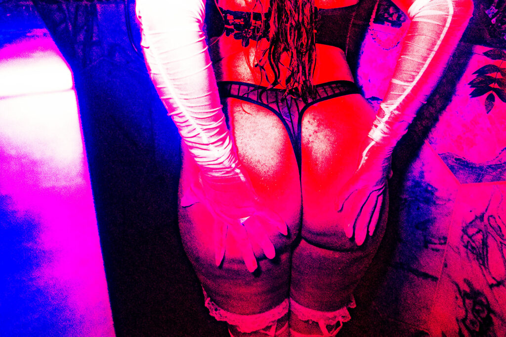 Bride in shower for boudoir shoot. showcasing her ring and edited like a comic book style