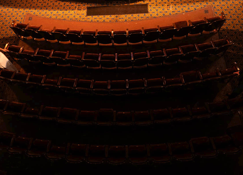 Animated gif of couple running through the seats of the Tampa Theatre